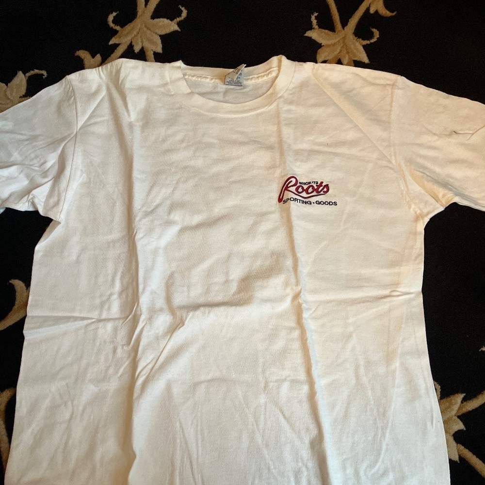 Vintage white men’s roots T-shirt. 1990s.